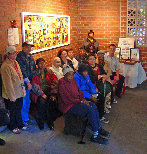 Group portrait of participants at the ribbon cutting ceremony who created the ceramic tile mural at Frederick Douglass Senior Center.