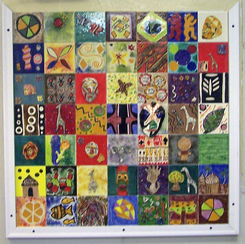 African textiles worn by the participants and adorning the walls of the center inspired this mural.